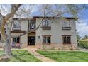 Beautiful two-story home with manicured lawn and inviting walkway leading to the front door at 2931 S Cook St, Denver, CO 80210