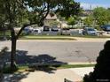 Exterior view of a well-organized parking lot and surrounding community with well-maintained landscape at 7111 S Wenatchee Way # C, Aurora, CO 80016