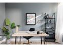 Bright home office setup featuring a stylish desk, shelving, and ample natural light for productivity at 3145 W 19Th Ave, Denver, CO 80204