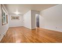 Spacious living room with hardwood floors, neutral paint, and natural light at 2885 S Gilpin St, Denver, CO 80210
