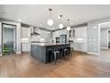 Spacious kitchen with large island, stainless steel appliances, and modern finishes at 6400 Barnstead Dr, Castle Pines, CO 80108