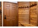 Charming entryway boasts rustic wood accents, a convenient coat rack, and a welcoming ambiance at 305 S Park Ave # 205, Breckenridge, CO 80424