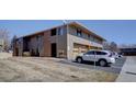 Exterior view of a multi-Gathering home with attached garages and parking for residents and visitors at 1105 Bacchus Dr # F8, Lafayette, CO 80026