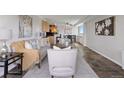 Open living space with combined living, dining, and kitchen areas, modern decor and plenty of natural light at 909 N Logan St # 11A, Denver, CO 80203