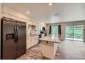 Bright, updated kitchen with a spacious island, stainless steel refrigerator and plenty of counter space at 679 S Pearl St, Elizabeth, CO 80107