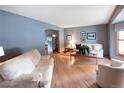 Inviting living room features hardwood floors, and neutral paint at 17530 E Caspian Pl, Aurora, CO 80013