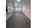 An inviting living area with hardwood flooring and natural light from the window at 4665 W 6Th Ave # 21, Denver, CO 80204