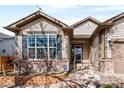 Charming home exterior with a well-maintained yard and decorative water fountain at 21069 Woodside Ln, Parker, CO 80138
