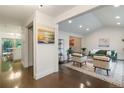 Open concept living room with stylish decor and hardwood floors at 6581 E Heritage Pl, Englewood, CO 80111