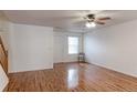 Open living space with hardwood floors, lots of natural light, and white painted walls at 11149 Gaylord St, Northglenn, CO 80233