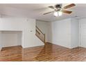 Inviting living area with hardwood floors and a classic wood staircase at 11149 Gaylord St, Northglenn, CO 80233