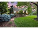 Spacious yard with lush green grass, mature trees, and well-maintained landscaping at 5530 E 6Th Ave Pkwy, Denver, CO 80220