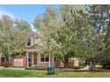 Inviting home with a manicured lawn and mature trees at 4069 S Abilene Cir # E, Aurora, CO 80014