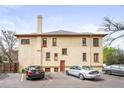 Rear view of the duplex showcasing a large parking area at 1331 N Ogden St # 1, Denver, CO 80218