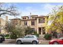 Attractive two-story duplex boasting curb appeal and mature trees at 1331 N Ogden St # 1, Denver, CO 80218