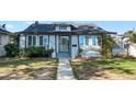 House exterior showcasing a classic style with landscaping and walkway at 2619 S Bannock St, Denver, CO 80223