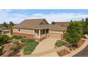Inviting home with a two-car garage, cozy front porch, and beautifully landscaped front yard at 22873 E David Pl, Aurora, CO 80016