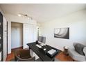 This office boasts hardwood floors, ample lighting, a closet, and space for focused work at 1250 S Monaco Pkwy # 44, Denver, CO 80224
