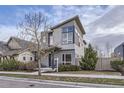 Attractive contemporary two-story home featuring a modern exterior, well-kept landscaping, and a for sale sign at 1558 White Violet Way, Louisville, CO 80027