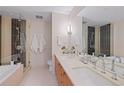 Elegant bathroom with double vanity, tiled shower, and ample space for personal care at 1620 Little Raven St # 103, Denver, CO 80202