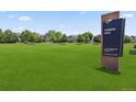 Community park with a large grassy area and sign; Farmers Park in Brighton, Colorado at 3823 Horiuchi St, Brighton, CO 80601