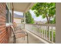 View from the front porch with chairs, offering a relaxing outdoor space at 4426 Windmill Dr, Brighton, CO 80601