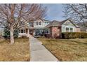 Charming two-story home with a well-manicured lawn and inviting front entrance at 3188 Soaring Eagle Ln, Castle Rock, CO 80109