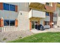 Ground floor patio featuring an outdoor grill and sliding glass door at 10211 Ura Ln # 3-104, Thornton, CO 80260