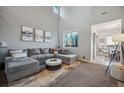 Spacious living room featuring a comfortable sectional sofa at 24758 E Arizona Cir, Aurora, CO 80018