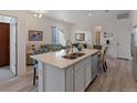 Open concept kitchen with island and stainless steel appliances at 9287 Twenty Mile Rd # 401, Parker, CO 80134