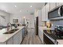 Open concept kitchen featuring stainless steel appliances at 9287 Twenty Mile Rd # 401, Parker, CO 80134