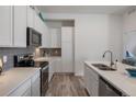 Modern kitchen with stainless steel appliances and white cabinets at 9287 Twenty Mile Rd # 401, Parker, CO 80134