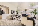 Comfortable living room with vaulted ceilings, a brick fireplace, and neutral tones for a serene ambiance at 5016 S Nelson St # C, Littleton, CO 80127