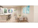 Light-filled dining area adjacent to the kitchen at 22313 E 38Th Pl, Aurora, CO 80019