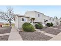 Charming multi-level home featuring tidy gravel yard, mature landscaping, and inviting entryway at 5711 W 92Nd Ave # 25, Westminster, CO 80031