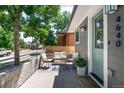 Inviting front porch with seating, a colorful rug, and stylish decor at 4640 W 39Th Ave, Denver, CO 80212