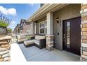 Welcoming front porch with stylish seating and views of the neighborhood at 1500 Sun Way, Lafayette, CO 80026