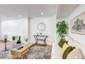 Bright living room featuring modern décor and stylish furnishings at 1250 N Humboldt St # 202, Denver, CO 80218