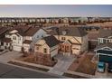 Beautifully designed home with a well-manicured lawn, neutral-toned exterior and multi-car garage at 10100 Isle St, Parker, CO 80134