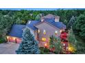 Two-story home with attached garage and deck, from an aerial view at 3351 Oak St, Wheat Ridge, CO 80033