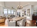 Inviting living room and dining area with hardwood floors, large windows and views at 5455 Landmark Pl # 413, Greenwood Village, CO 80111