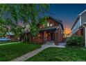 Charming two-story brick home with landscaped front yard and inviting entry at 890 S Vine St, Denver, CO 80209