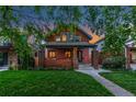 Charming brick two-story home with a well-manicured front lawn and inviting curb appeal at 890 S Vine St, Denver, CO 80209