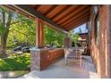Inviting front porch with a porch swing and comfortable seating area at 890 S Vine St, Denver, CO 80209