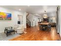 Bright, open-concept living space with hardwood floors and modern finishes at 890 S Vine St, Denver, CO 80209