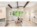 Bright dining room with vaulted ceilings, exposed beams, and lots of natural light at 41 Skyline Dr, Wheat Ridge, CO 80215