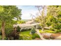 Beautifully landscaped home with a welcoming entrance and a view of the surrounding landscape at 41 Skyline Dr, Wheat Ridge, CO 80215