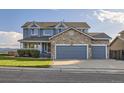 Charming two-story home with a stone facade and well-maintained landscaping at 8915 S Field Ct, Littleton, CO 80128