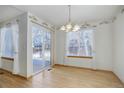 Bright dining room with sliding glass door to backyard at 3711 Bucknell Cir, Highlands Ranch, CO 80129