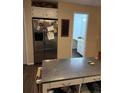 Spacious kitchen featuring stainless steel appliances, ample storage, and a functional island at 3839 E 135Th Way, Thornton, CO 80241